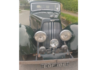 Green and clearly a classic car